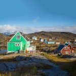 Inuit village in high Arctic set among hills. Arctic cruise Arctic holiday