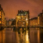 Night time view of buildings in Hamburg - Germany split by rivers. North Sea cruise