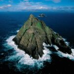 Cliffs of Skellig Islands rising out of the dark blue in the Celtic / Irish Sea. Sea cruise Celtic / Irish Sea.