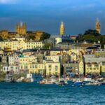 Buildings of Guernsey port town island view from the sea in the English Channel. Cruise Channel Islands