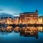 View of Helsinki - Finland at night with building lights across the water. Sea cruise Baltic sea