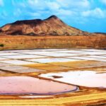 Pink and white salt pans before mountain in Pedra de Lume - Cape Verde. Cruise Cape Verde Islands