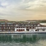 River cruise ship MS Misr in the Nile River Egypt. Classic paddle wheel look with wood and white exterior. River cruise Nile